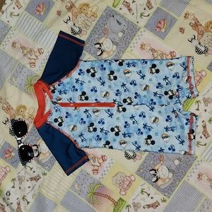 Disney Baby 6/9 Months short sleeve, half zip, snap bottoms swim suit.